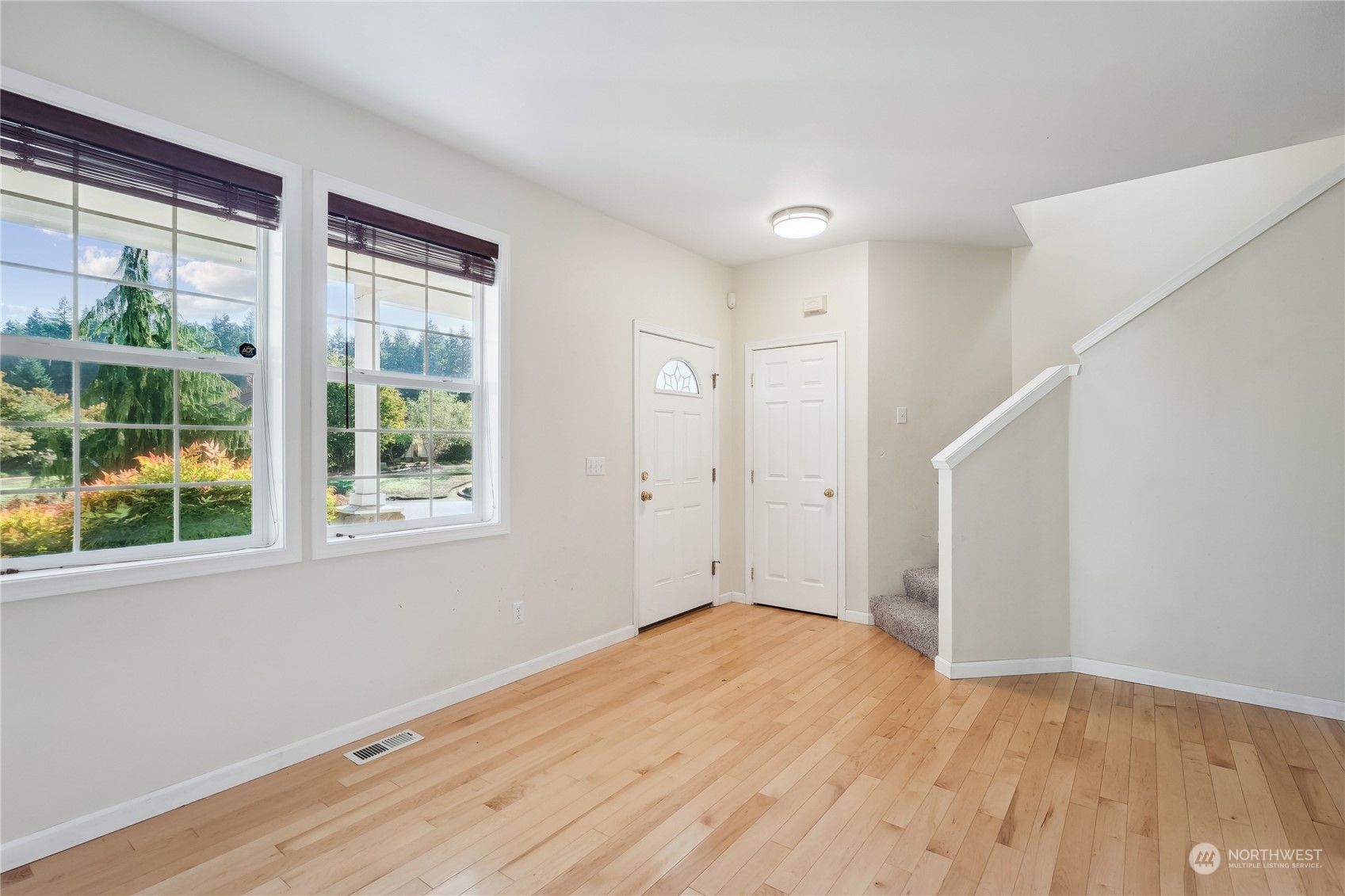 9639 39th Loop Northeast Olympia, WA 98516 - Photo 12 of 38 a view of empty room with wooden floor and fan