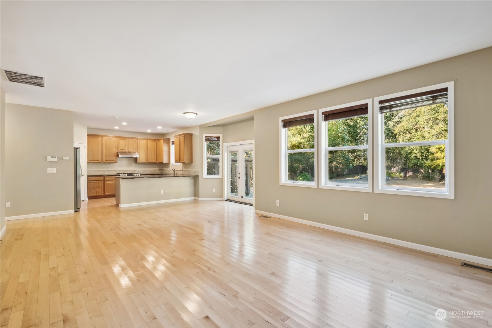 9639 39th Loop Northeast Olympia, WA 98516 - Photo 18 of 38 a view of an empty room with window and wooden floor