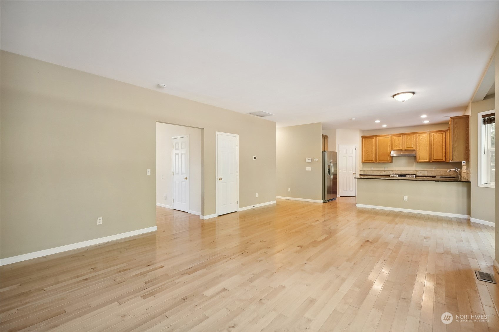 9639 39th Loop Northeast Olympia, WA 98516 - Photo 19 of 38 a view of an empty room with a kitchen