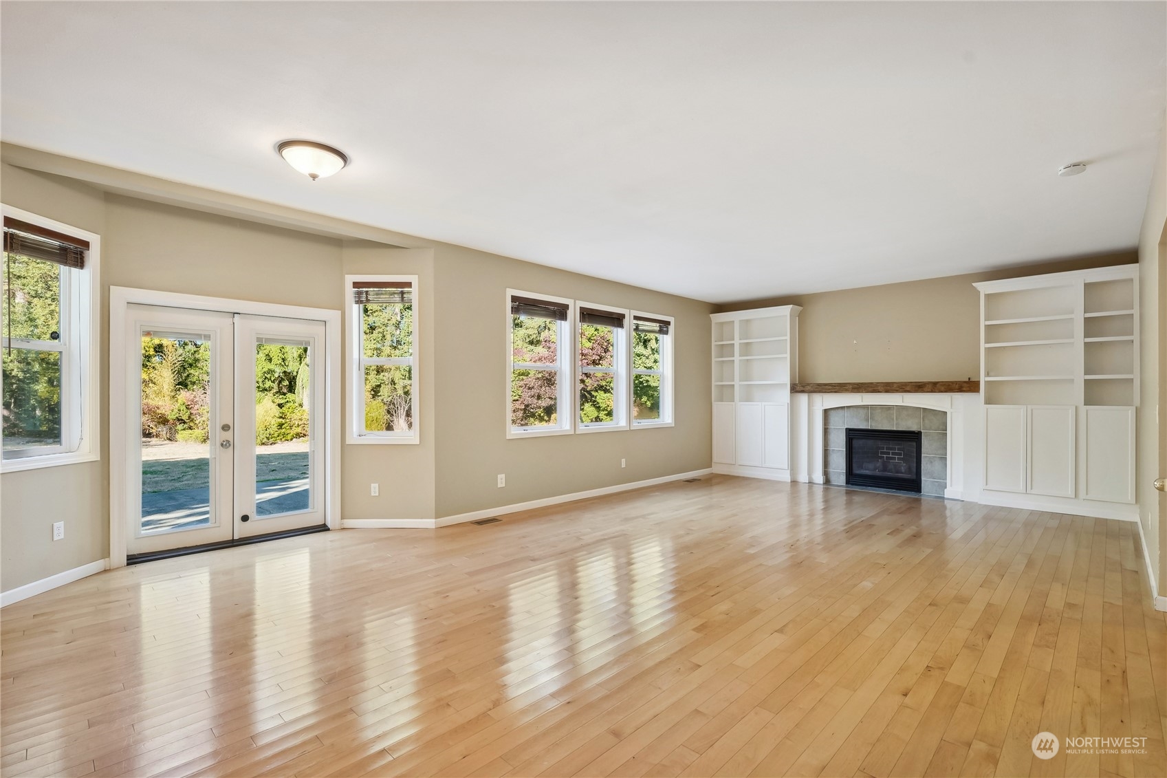 9639 39th Loop Northeast Olympia, WA 98516 - Photo 20 of 38 a view of an empty room with wooden floor and a window