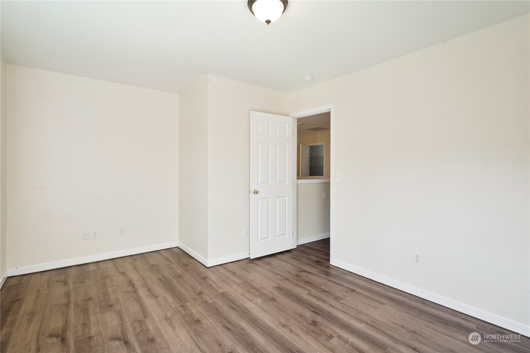 9639 39th Loop Northeast Olympia, WA 98516 - Photo 27 of 38 a view of an empty room with wooden floor