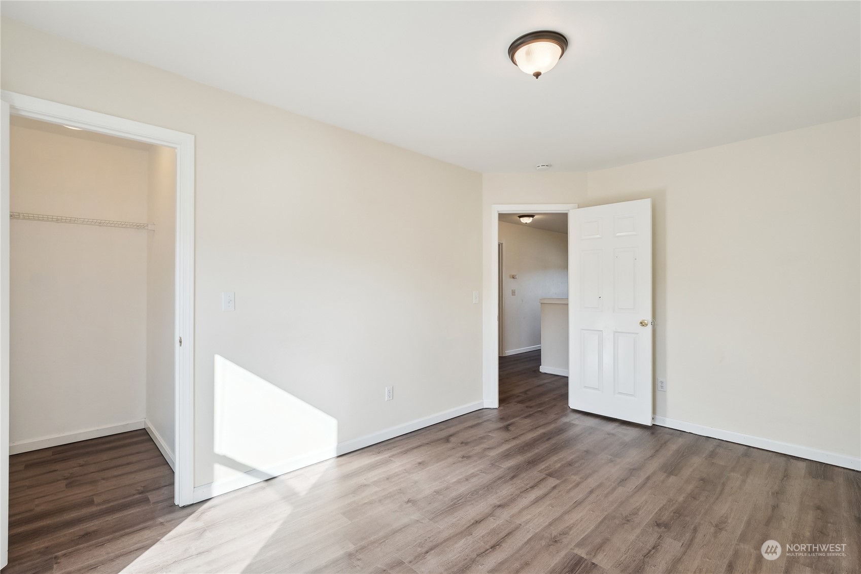 9639 39th Loop Northeast Olympia, WA 98516 - Photo 29 of 38 a view of an empty room with wooden floor and a window
