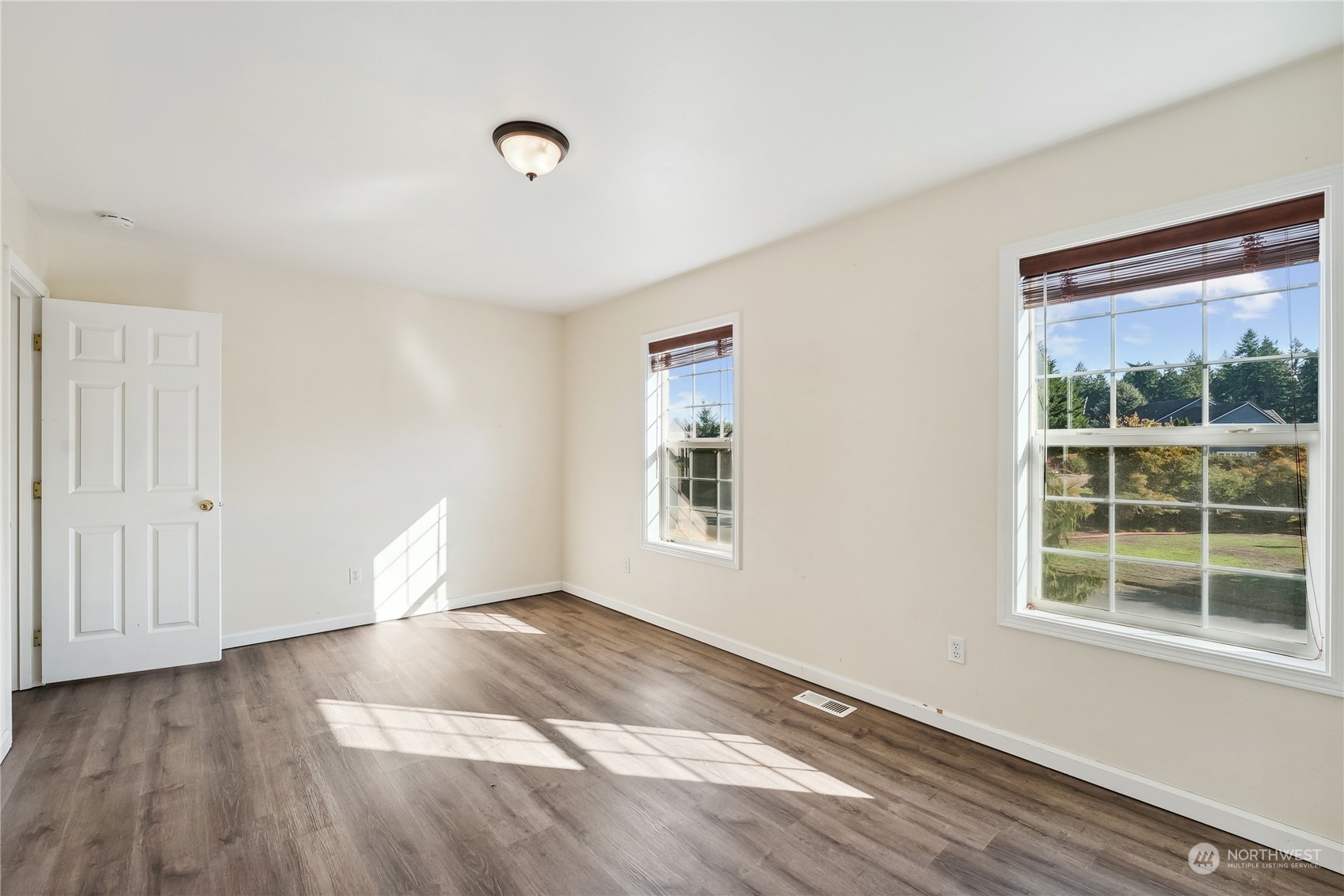 9639 39th Loop Northeast Olympia, WA 98516 - Photo 31 of 38 a view of an empty room with wooden floor and a window