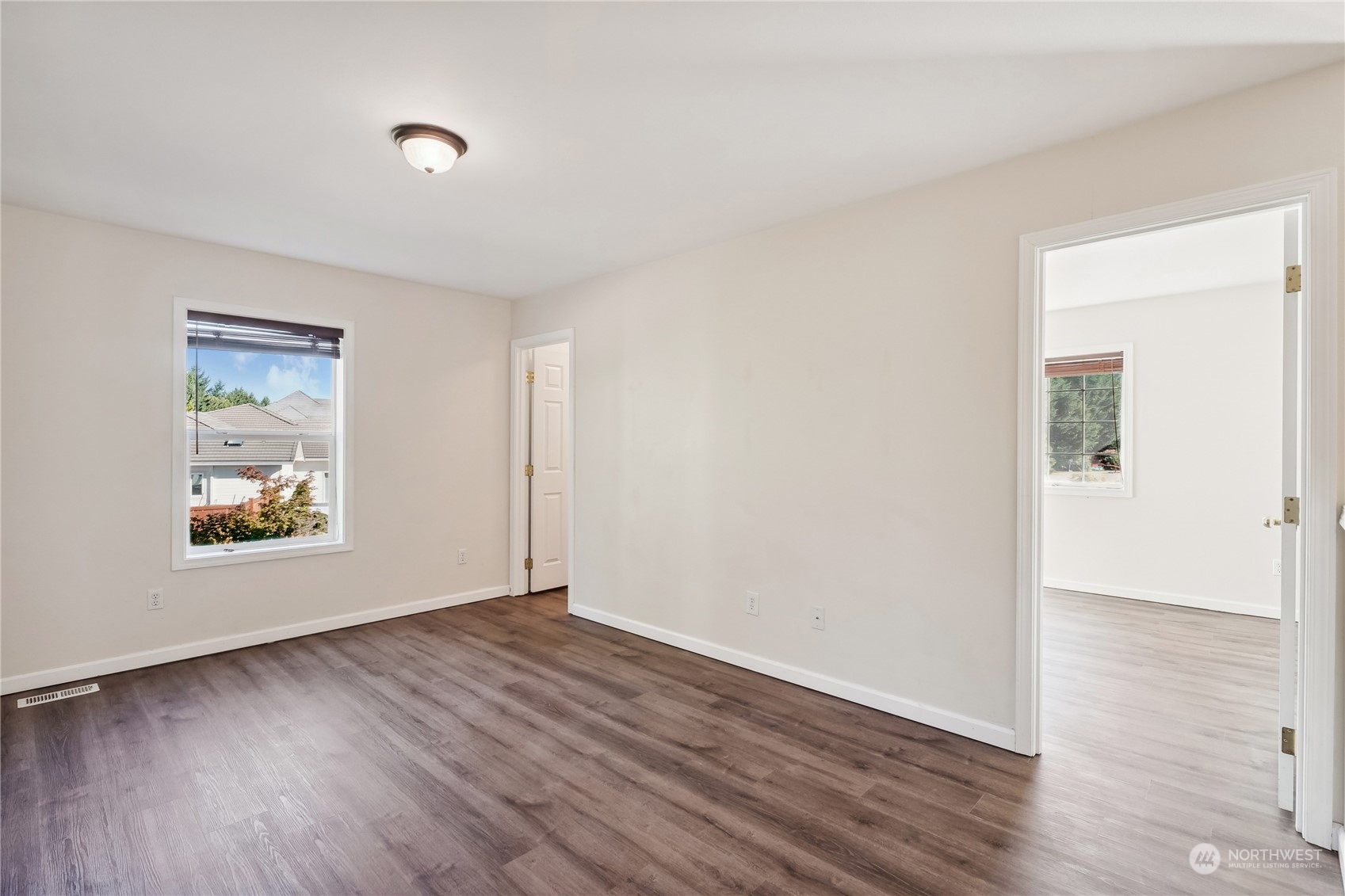 9639 39th Loop Northeast Olympia, WA 98516 - Photo 33 of 38 an empty room with wooden floor and window