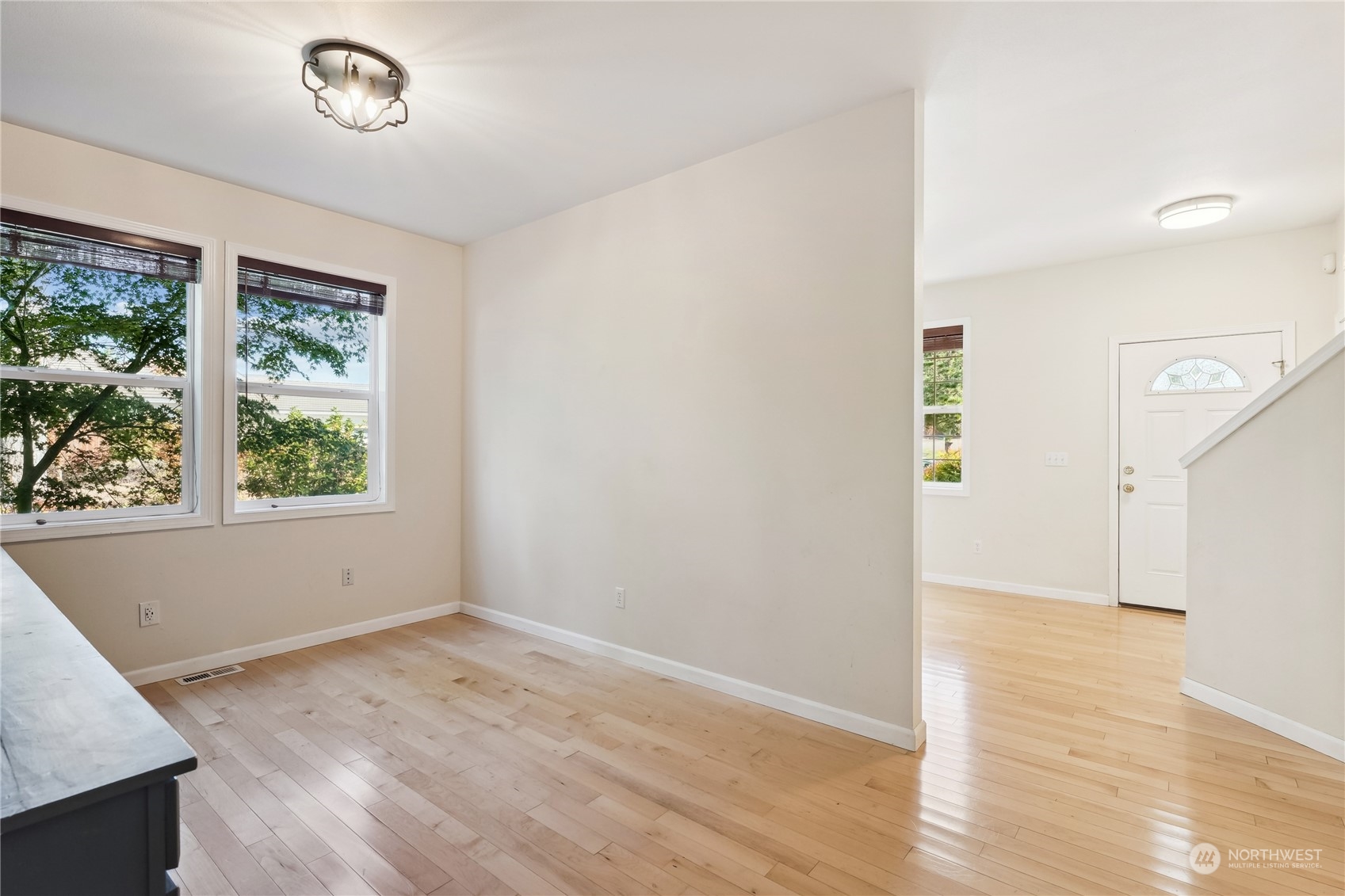 9639 39th Loop Northeast Olympia, WA 98516 - Photo 10 of 38 an empty room with wooden floor and windows