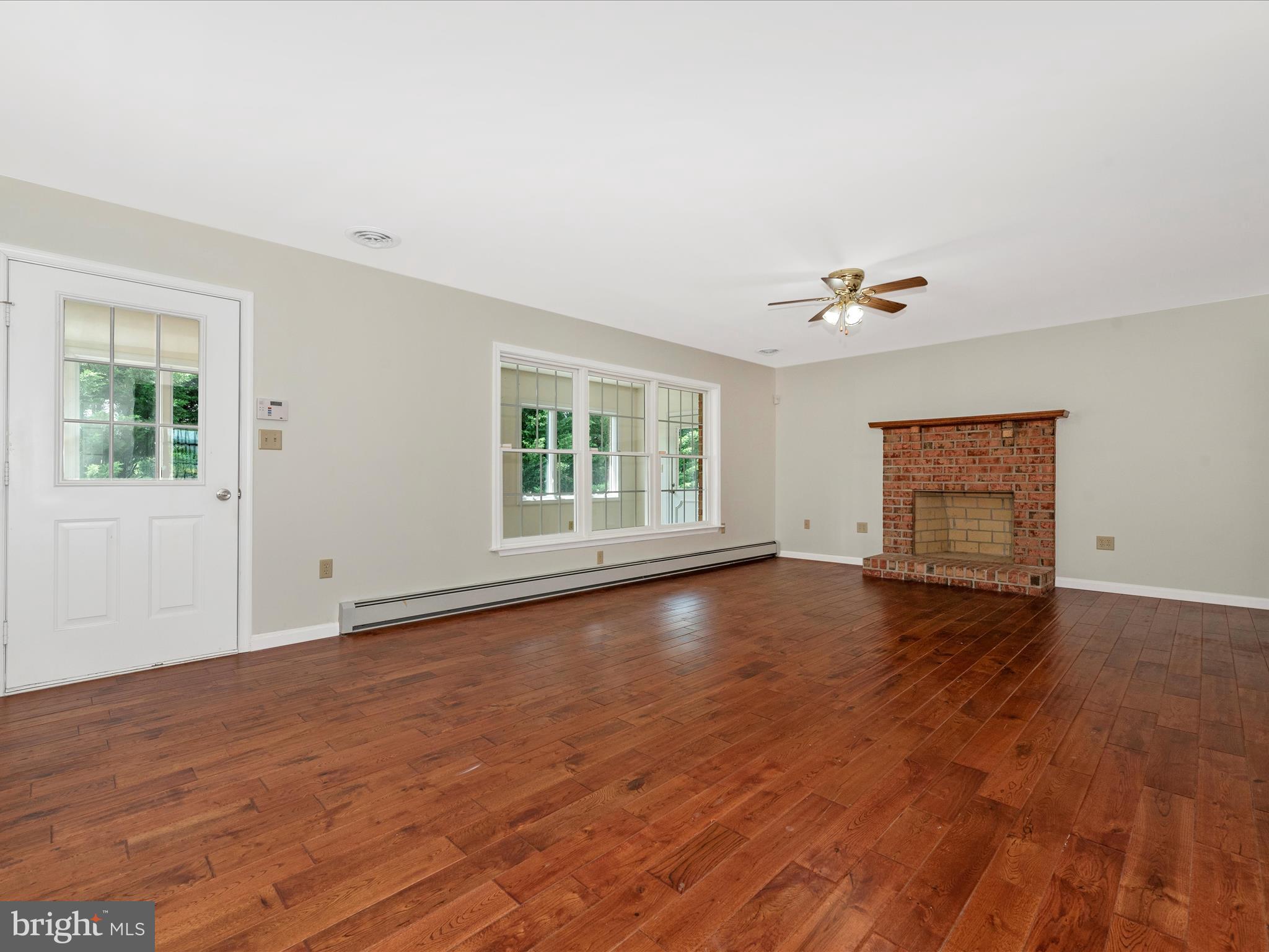 8543 Barnes Road Boonsboro, MD 21713 - Photo 7 of 52 and a brick, wood burning fireplace.
