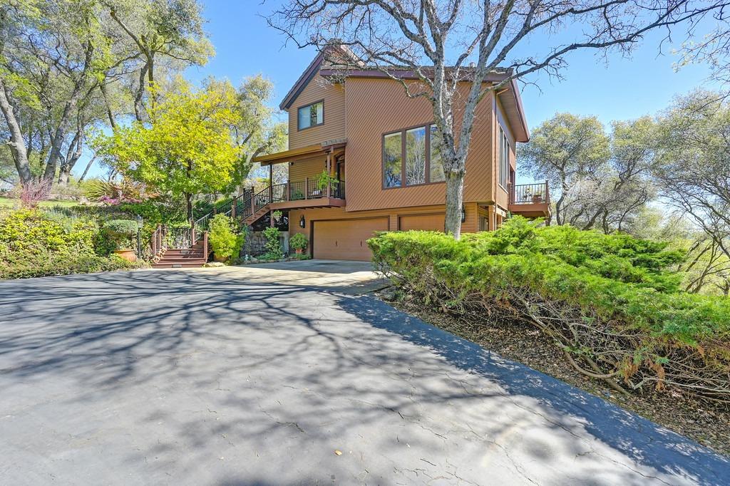 5487 Comstock Road Placerville, CA 95667 - Photo 1 of 1 a front view of a house with a yard and a garage