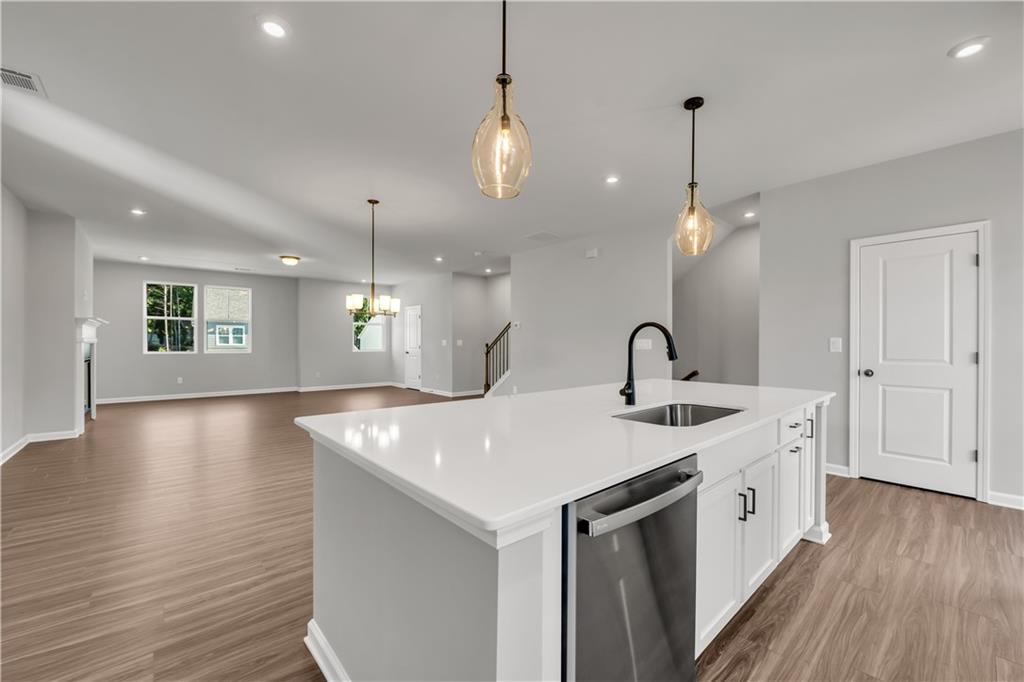 668 Devon Alley Acworth, GA 30102 - Photo 18 of 38 a view of a kitchen sink and chandelier