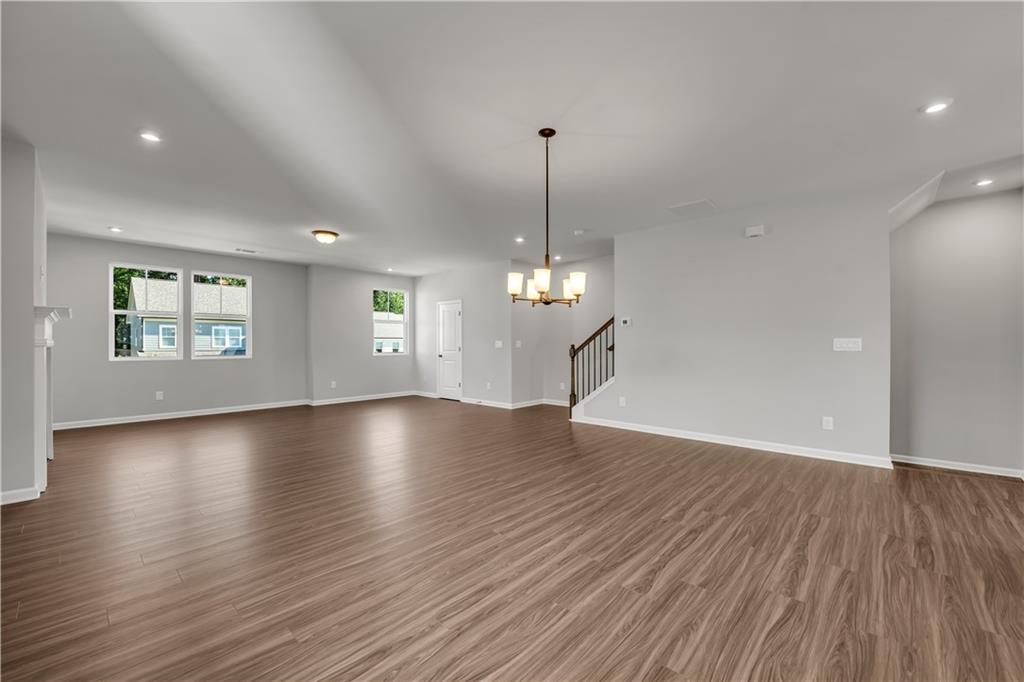 668 Devon Alley Acworth, GA 30102 - Photo 19 of 38 a view of empty room with wooden floor and window