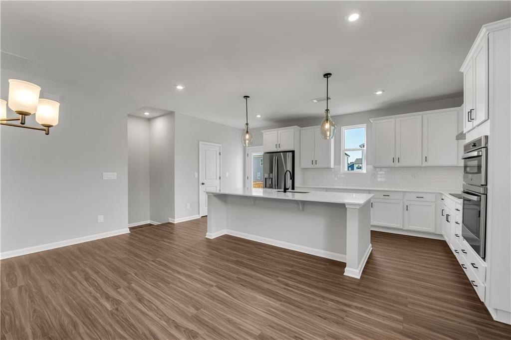 668 Devon Alley Acworth, GA 30102 - Photo 20 of 38 a kitchen with stainless steel appliances a refrigerator sink and microwave