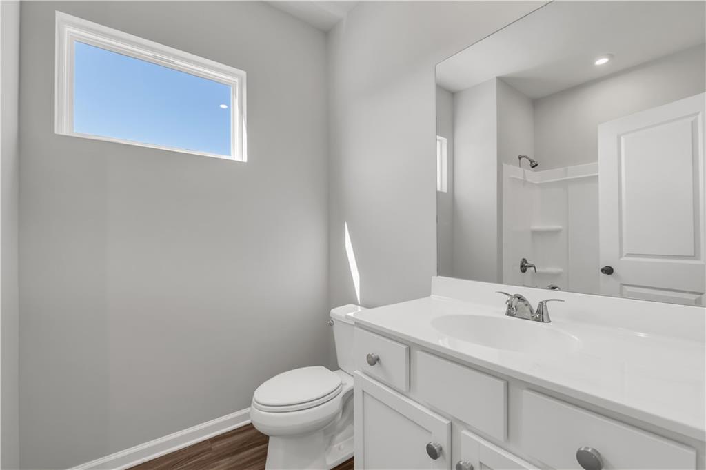 668 Devon Alley Acworth, GA 30102 - Photo 37 of 38 a bathroom with a sink toilet and a mirror