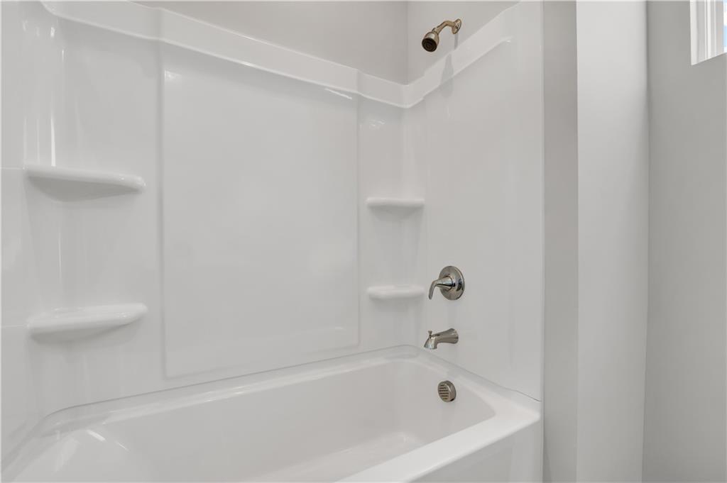 668 Devon Alley Acworth, GA 30102 - Photo 38 of 38 a bathroom with a bathtub
