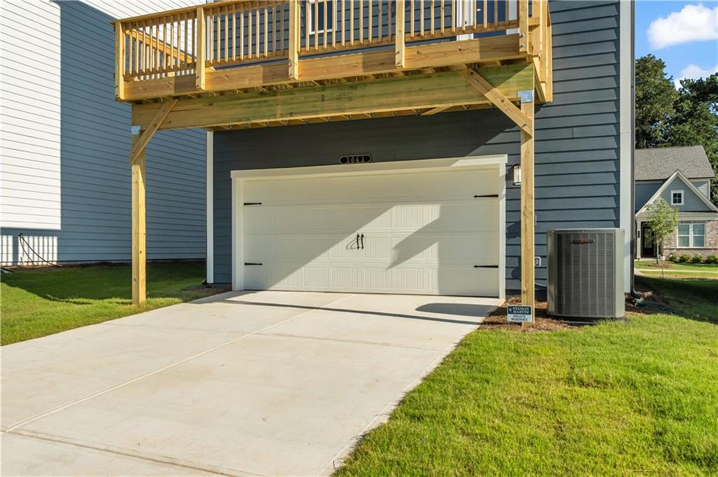 668 Devon Alley Acworth, GA 30102 - Photo 6 of 38 a front view of a house with a yard