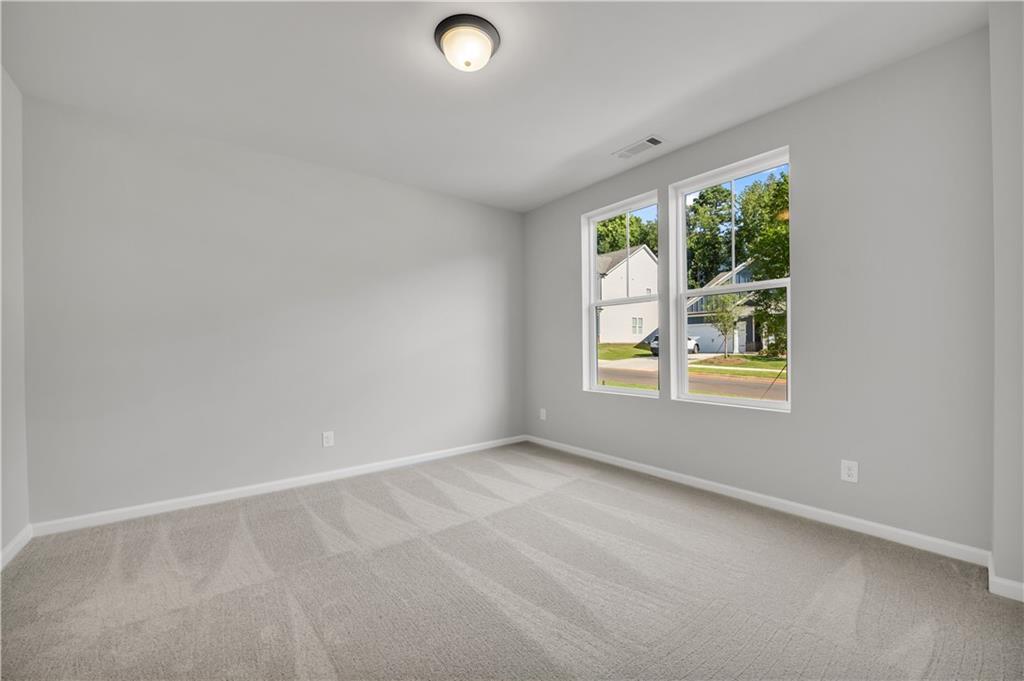 668 Devon Alley Acworth, GA 30102 - Photo 9 of 38 an empty room with a window