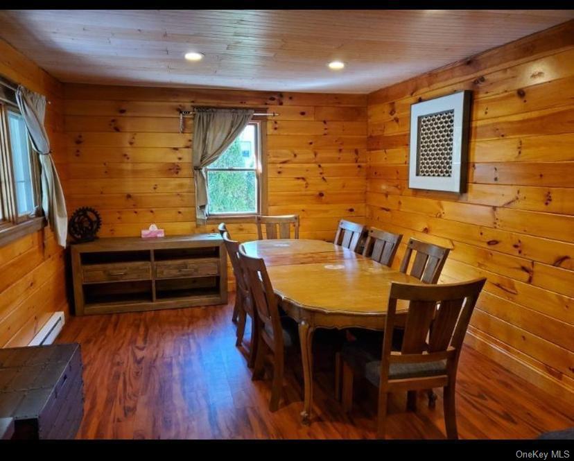 111 Spring Street Tannersville, NY 12485 - Photo 3 of 9 a dining room with furniture and wooden floor