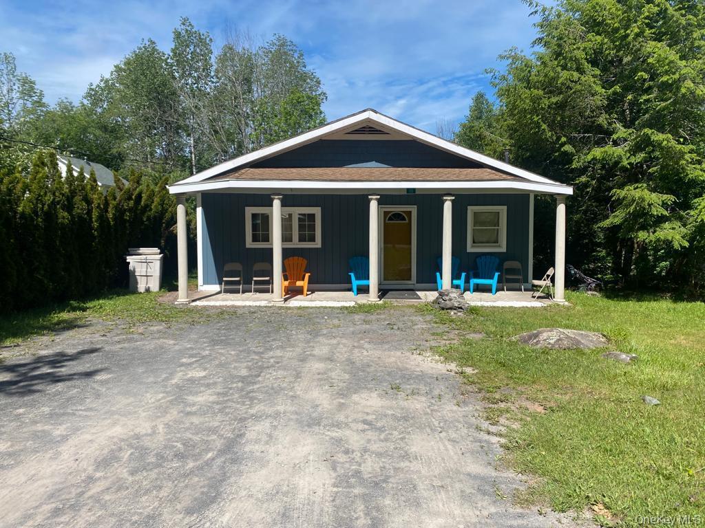 111 Spring Street Tannersville, NY 12485 - Photo 5 of 9 a view of a house with a yard and potted plants