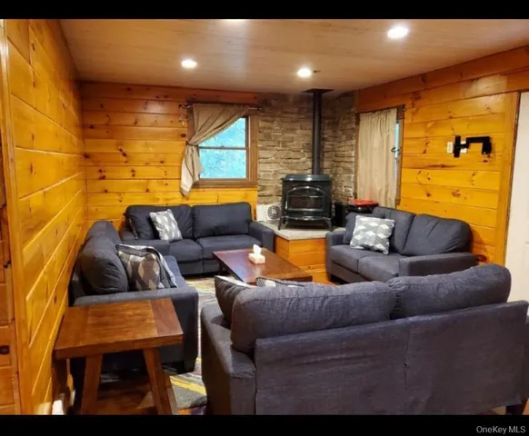 a media room with lots of chairs and a projector screen