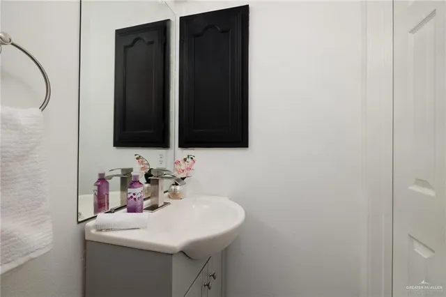 a bathroom with a sink and a mirror