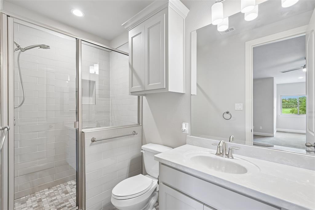 1657 Florence Road Keller, TX 76262 - Photo 29 of 40 a bathroom with a sink toilet vanity and shower