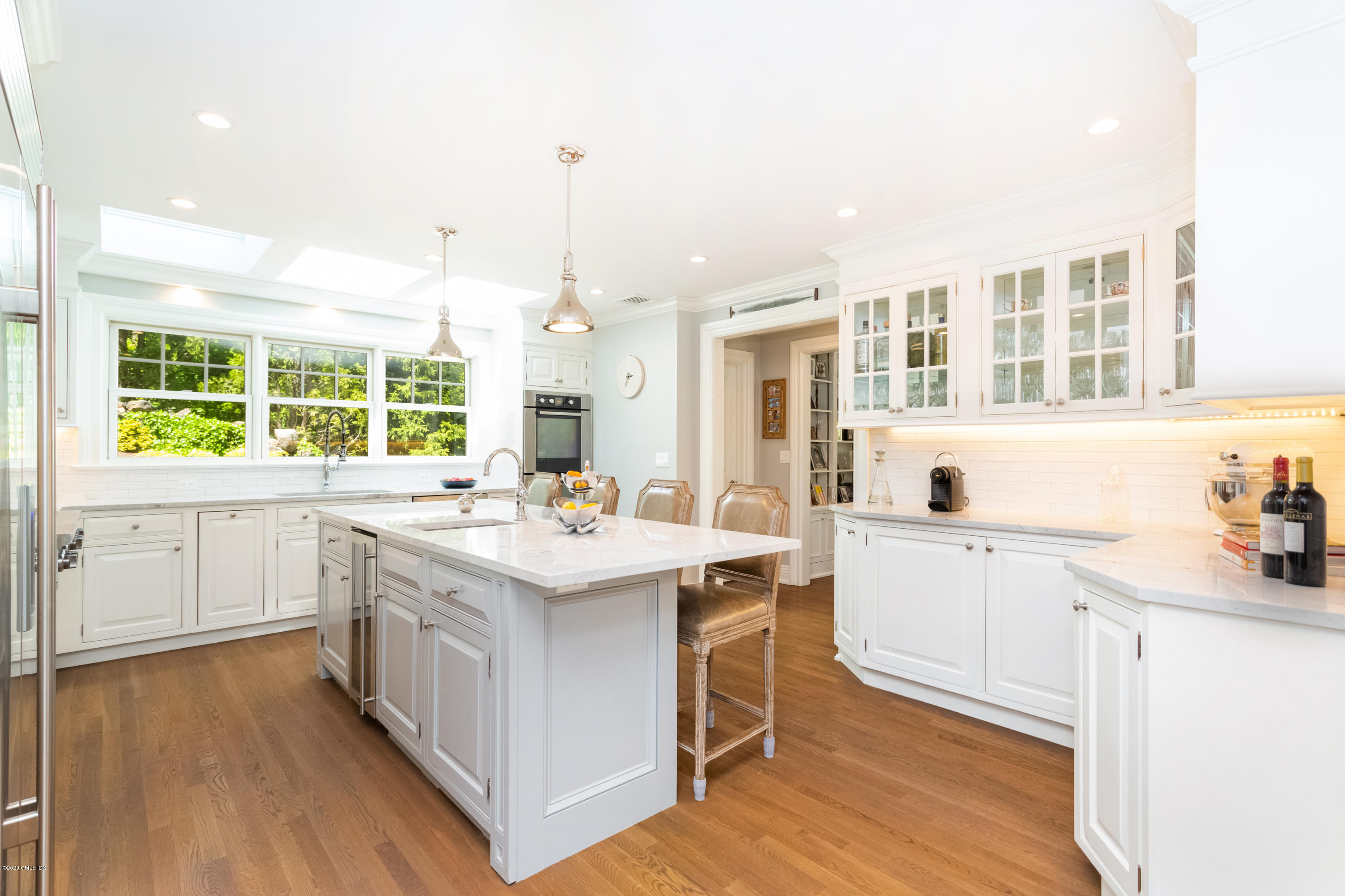 36 Evergreen Road Greenwich, CT 06830 - Photo 11 of 40 a kitchen with a sink stove and cabinets