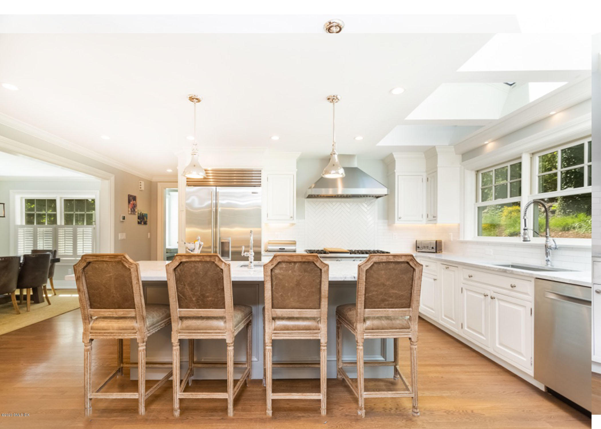 36 Evergreen Road Greenwich, CT 06830 - Photo 12 of 40 a large kitchen with a table and chairs