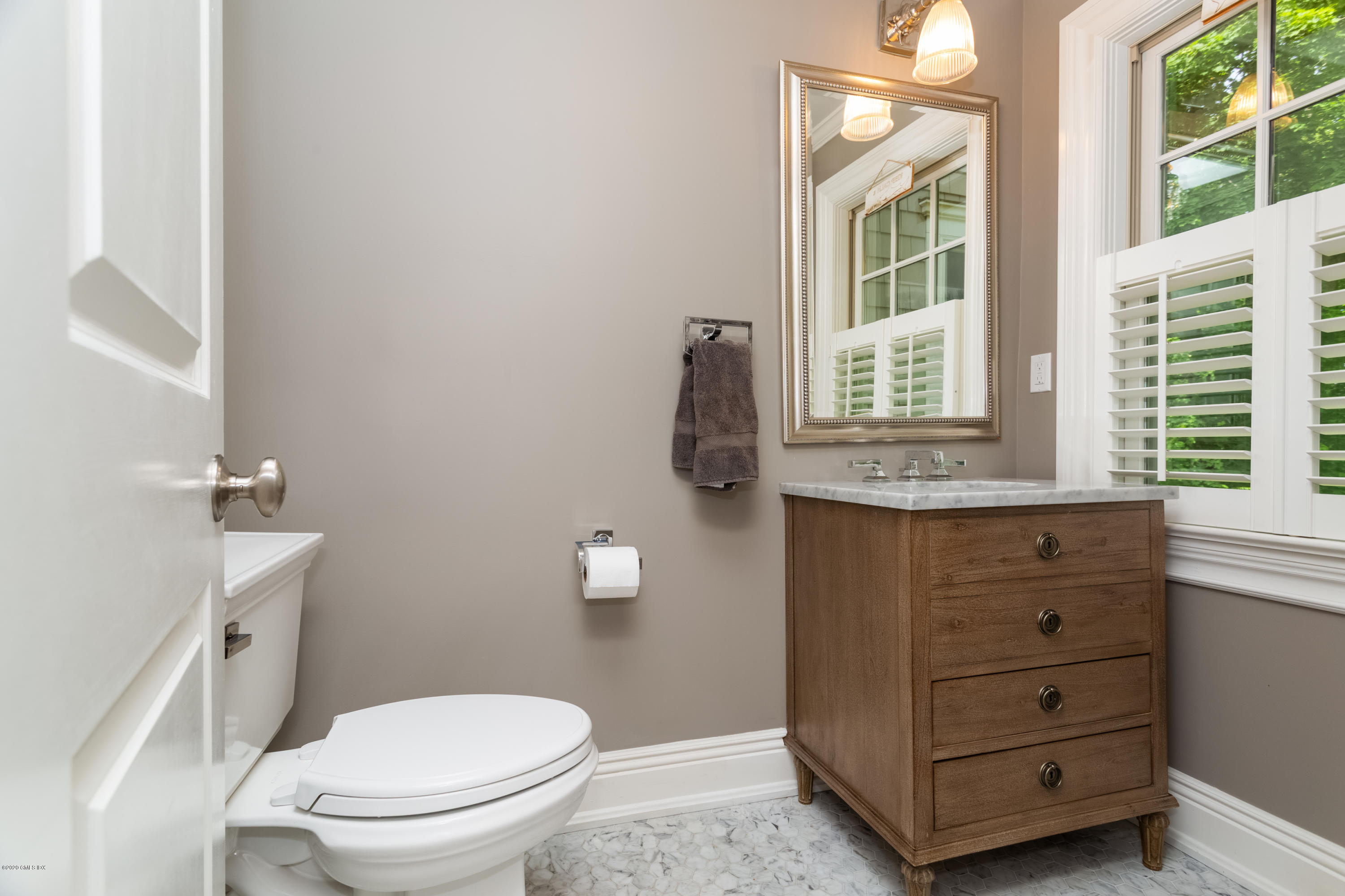 36 Evergreen Road Greenwich, CT 06830 - Photo 13 of 40 a bathroom with a toilet sink and mirror