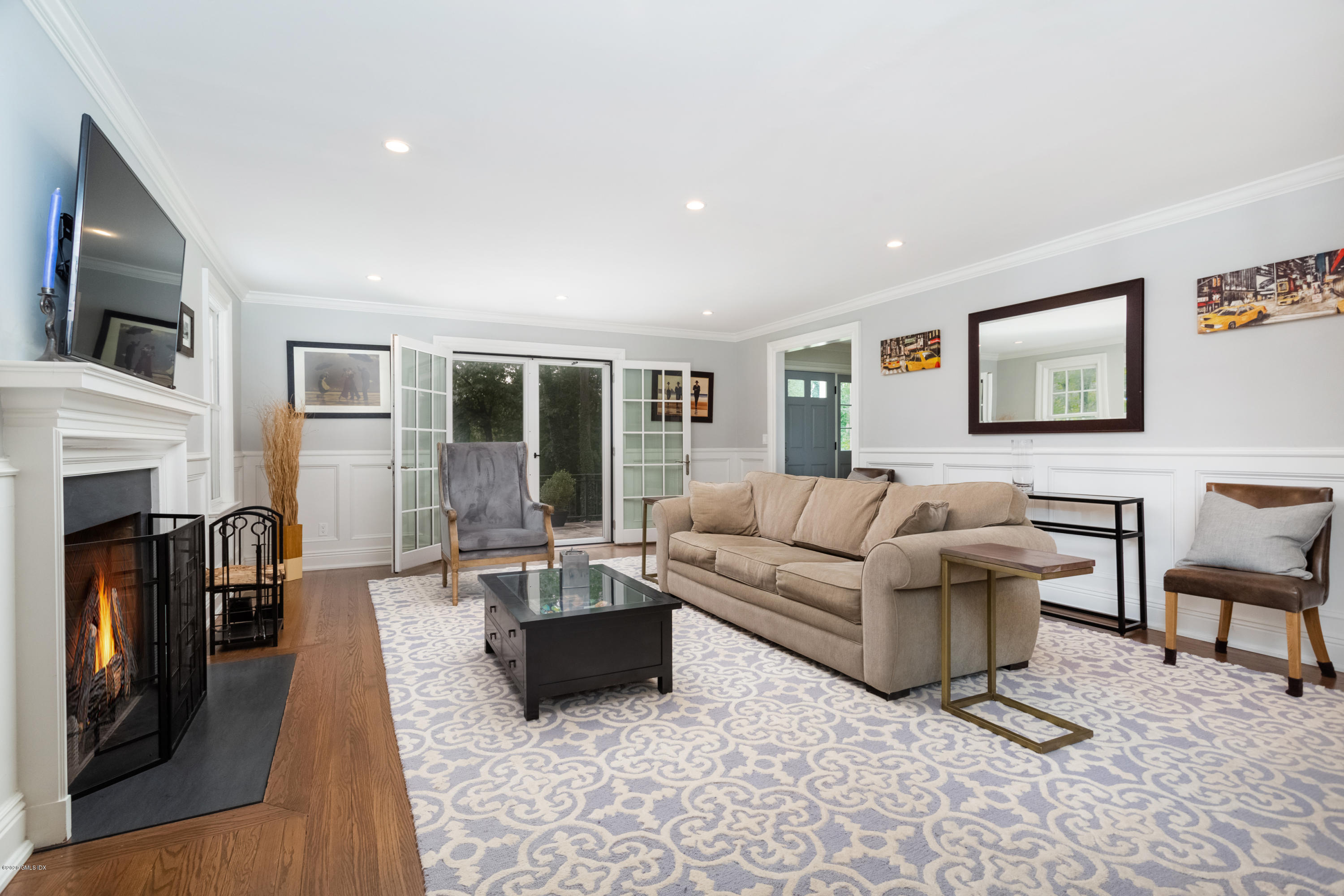36 Evergreen Road Greenwich, CT 06830 - Photo 14 of 40 a living room with furniture fireplace and flat screen tv