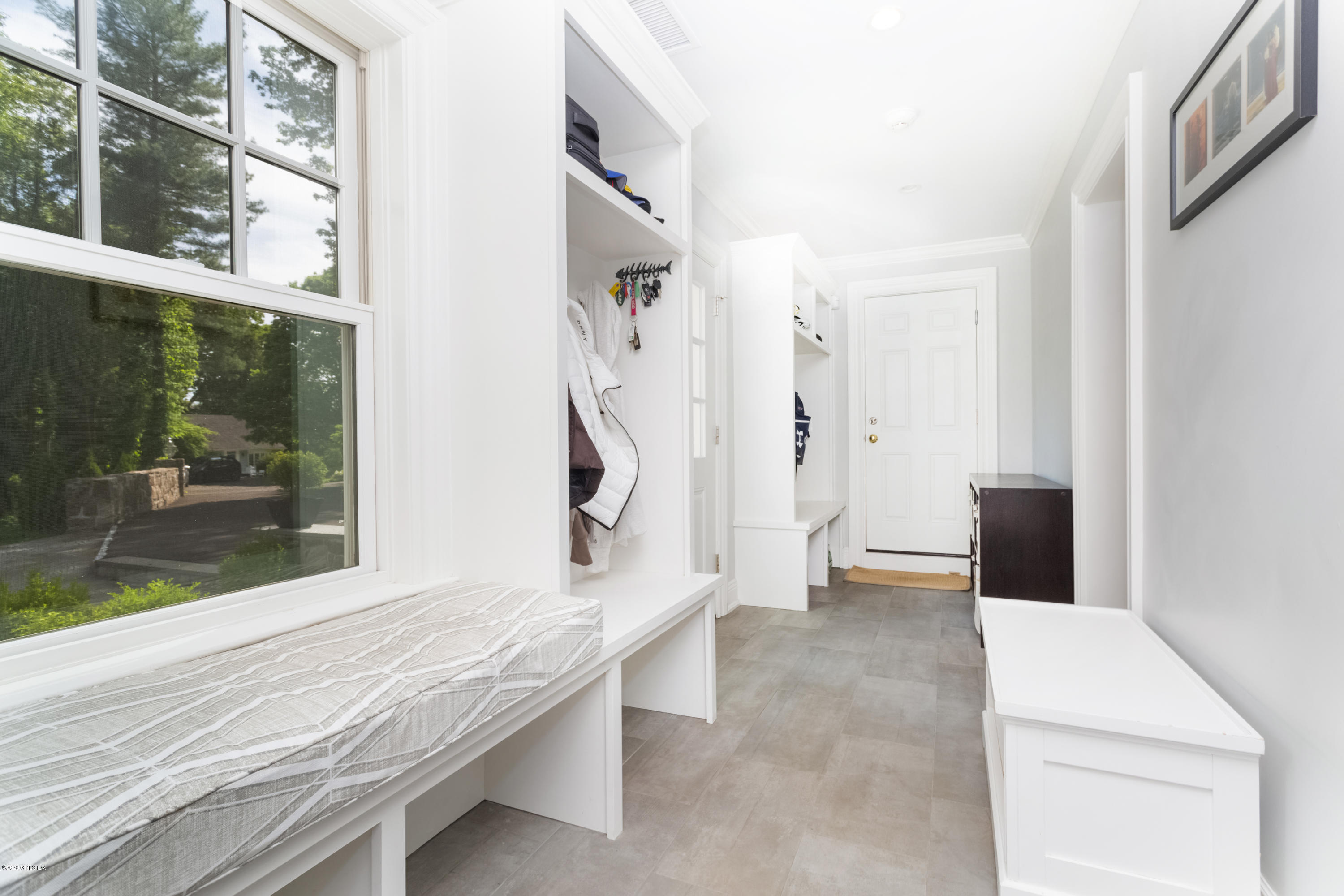 36 Evergreen Road Greenwich, CT 06830 - Photo 18 of 40 a living room with a table and a large window
