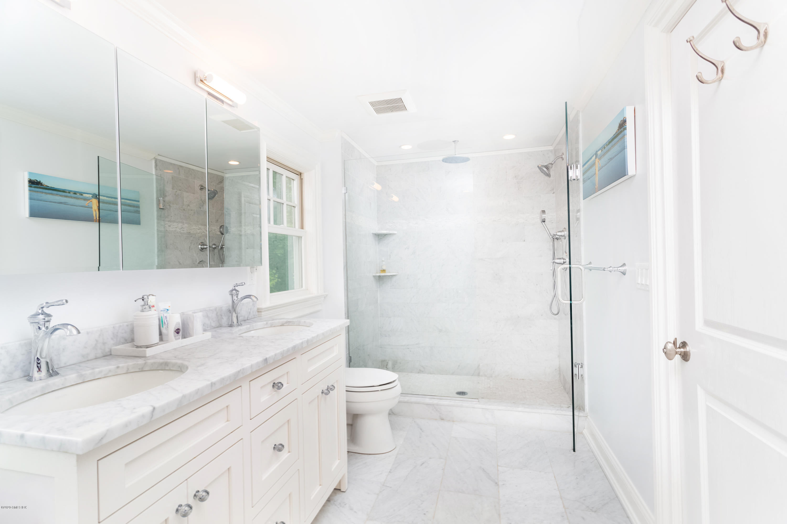 36 Evergreen Road Greenwich, CT 06830 - Photo 25 of 40 a bathroom with a double vanity sink toilet mirror and shower