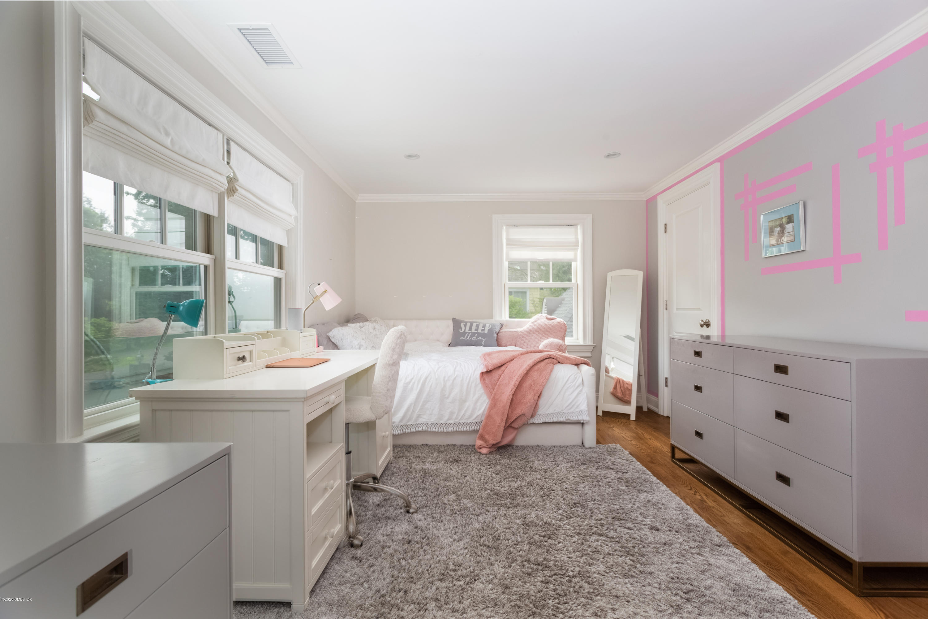 36 Evergreen Road Greenwich, CT 06830 - Photo 26 of 40 a room with a bed and a large window