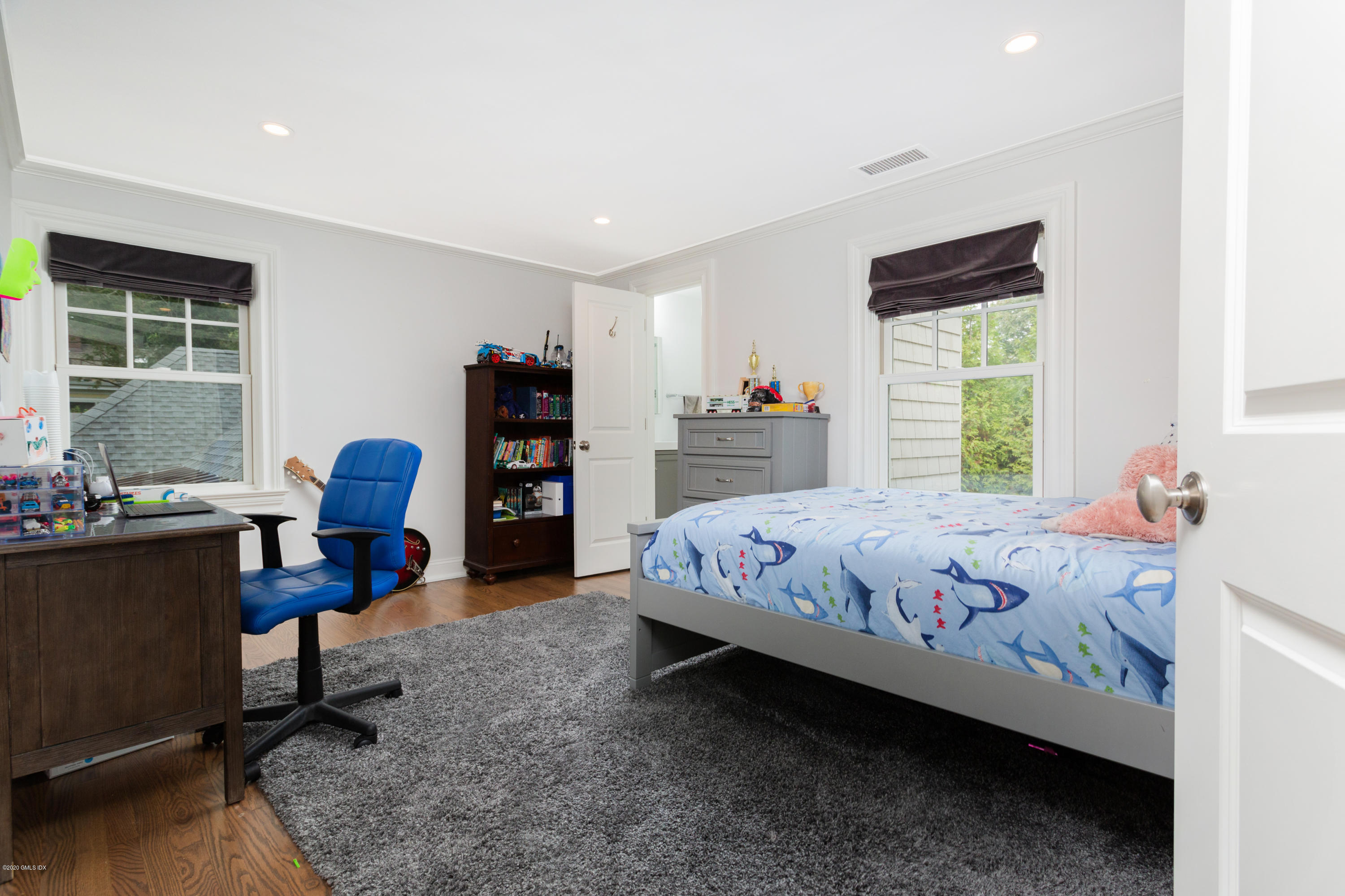 36 Evergreen Road Greenwich, CT 06830 - Photo 28 of 40 a bedroom with a bed and a window