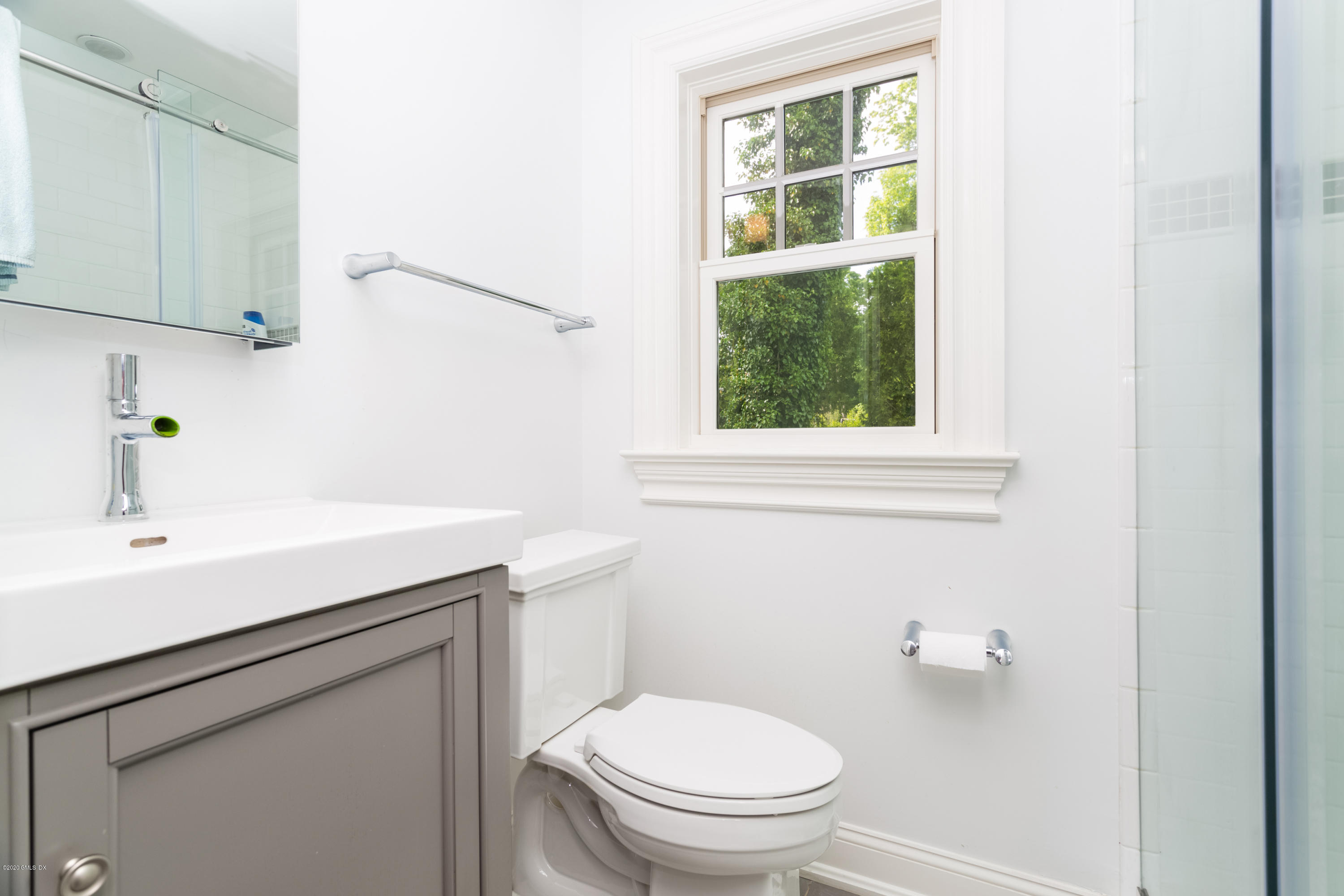 36 Evergreen Road Greenwich, CT 06830 - Photo 29 of 40 a bathroom with a sink a toilet and a window
