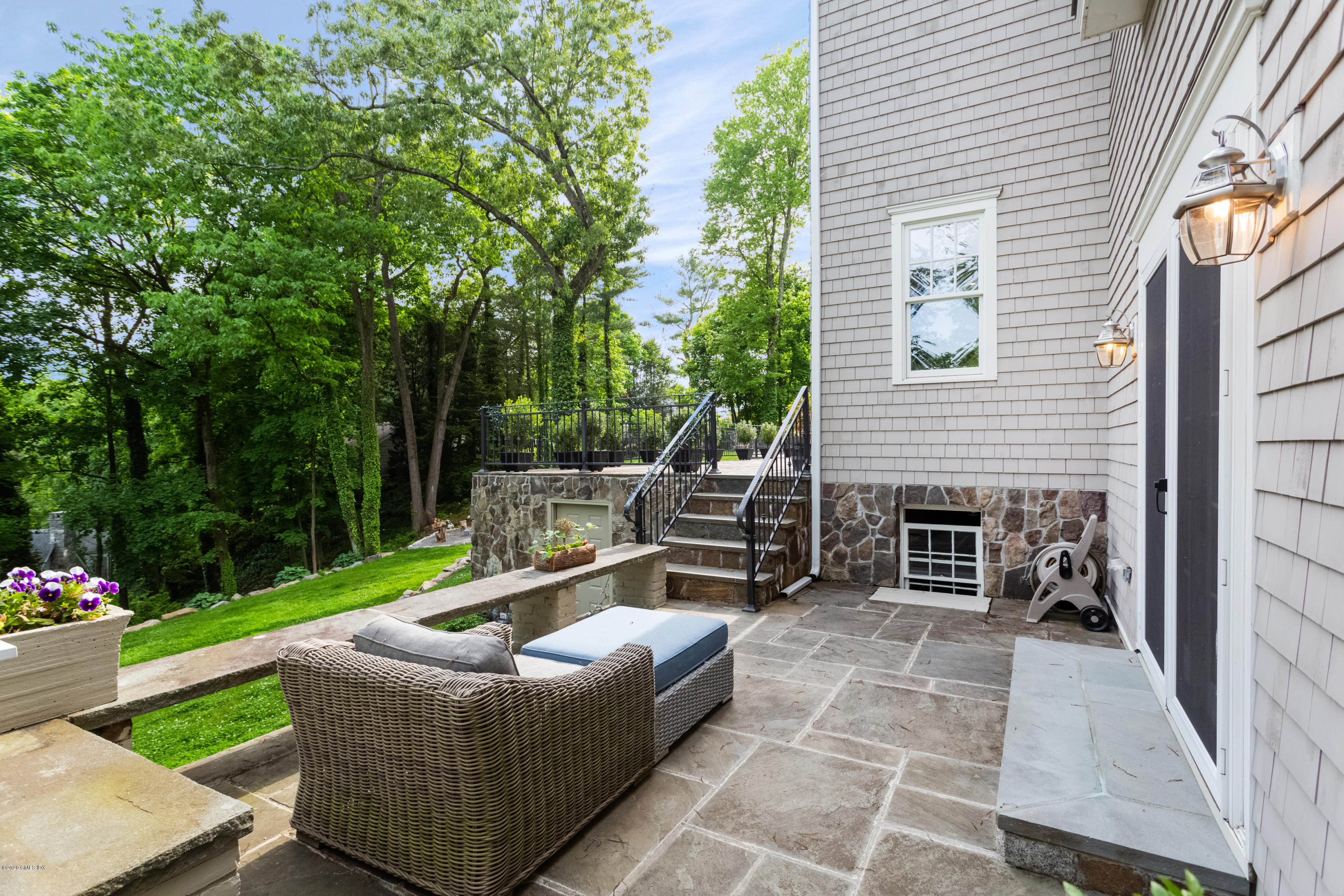 36 Evergreen Road Greenwich, CT 06830 - Photo 30 of 40 a view of a couches and a fire pit in the patio