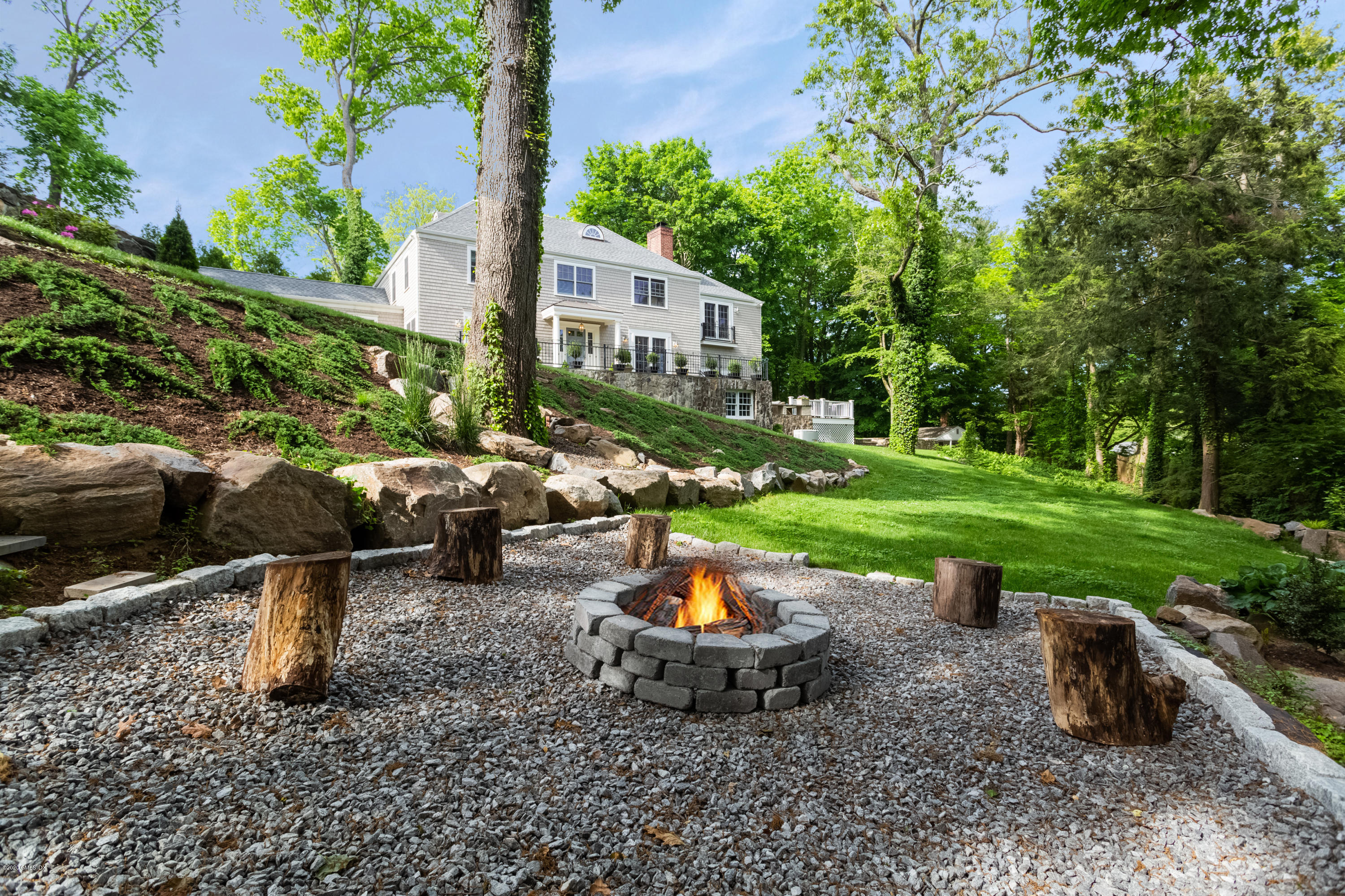36 Evergreen Road Greenwich, CT 06830 - Photo 33 of 40 a table and chairs sitting in the garden