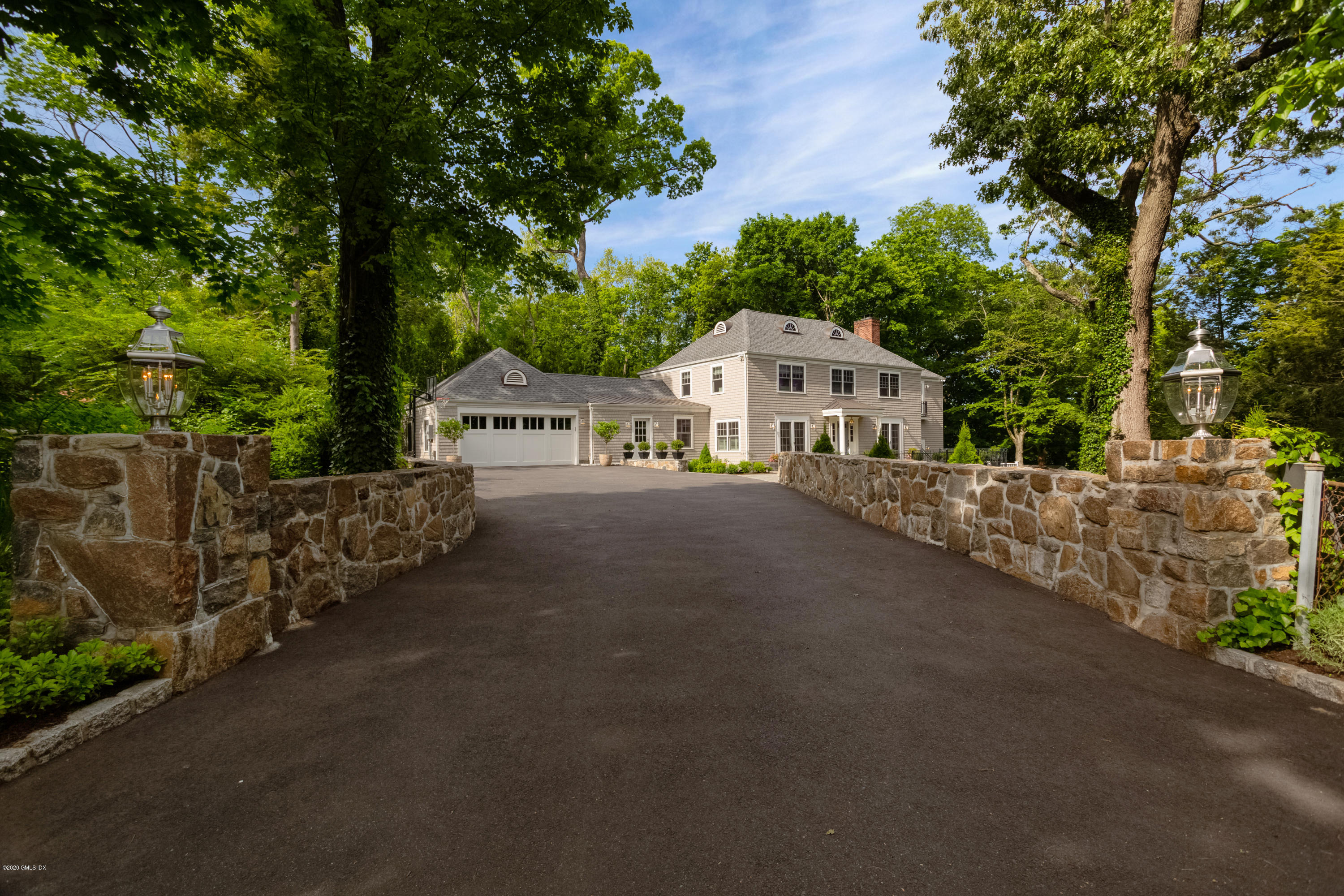 36 Evergreen Road Greenwich, CT 06830 - Photo 35 of 40 a view of a house with a street view