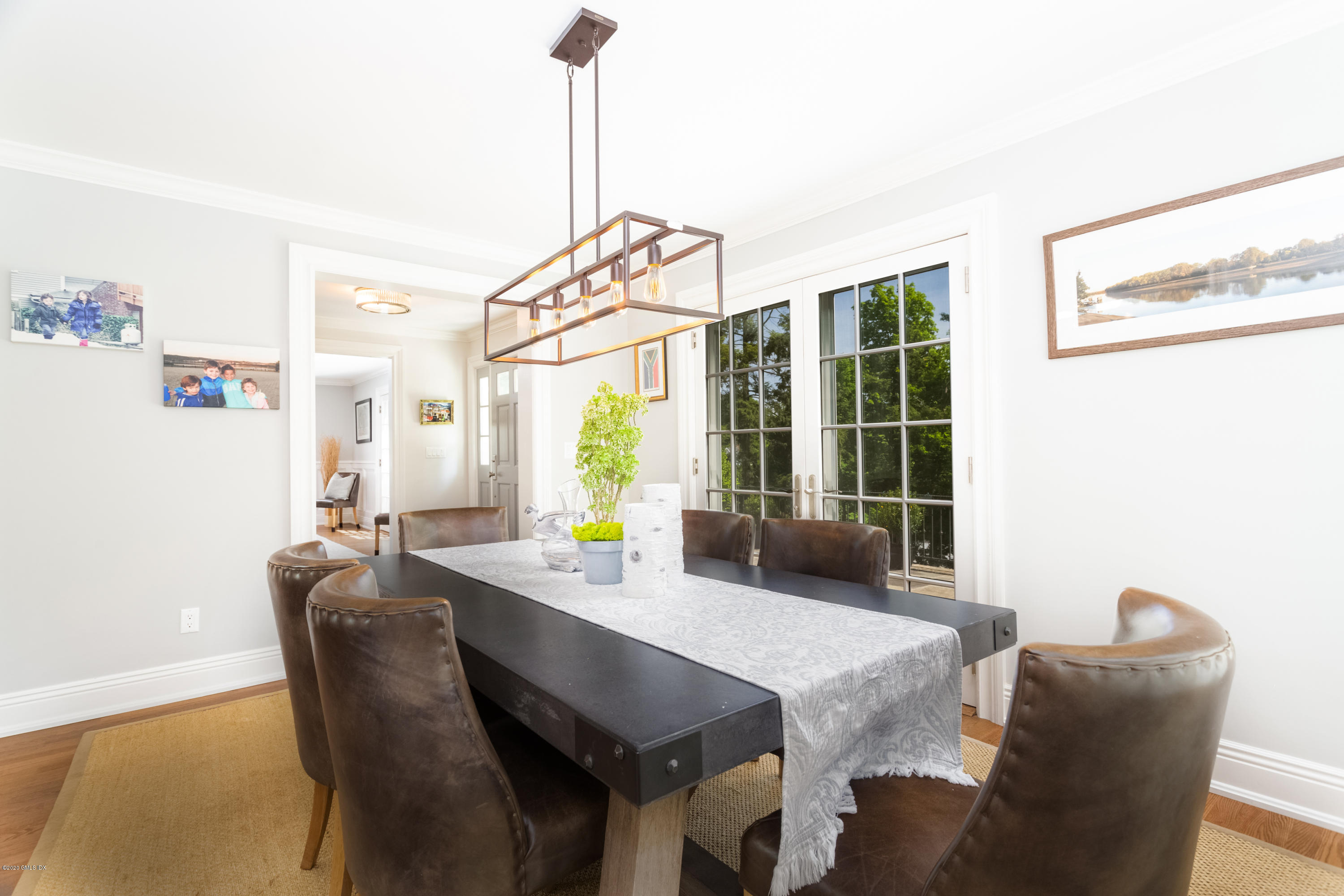 36 Evergreen Road Greenwich, CT 06830 - Photo 8 of 40 a dining room with furniture a chandelier and wooden floor