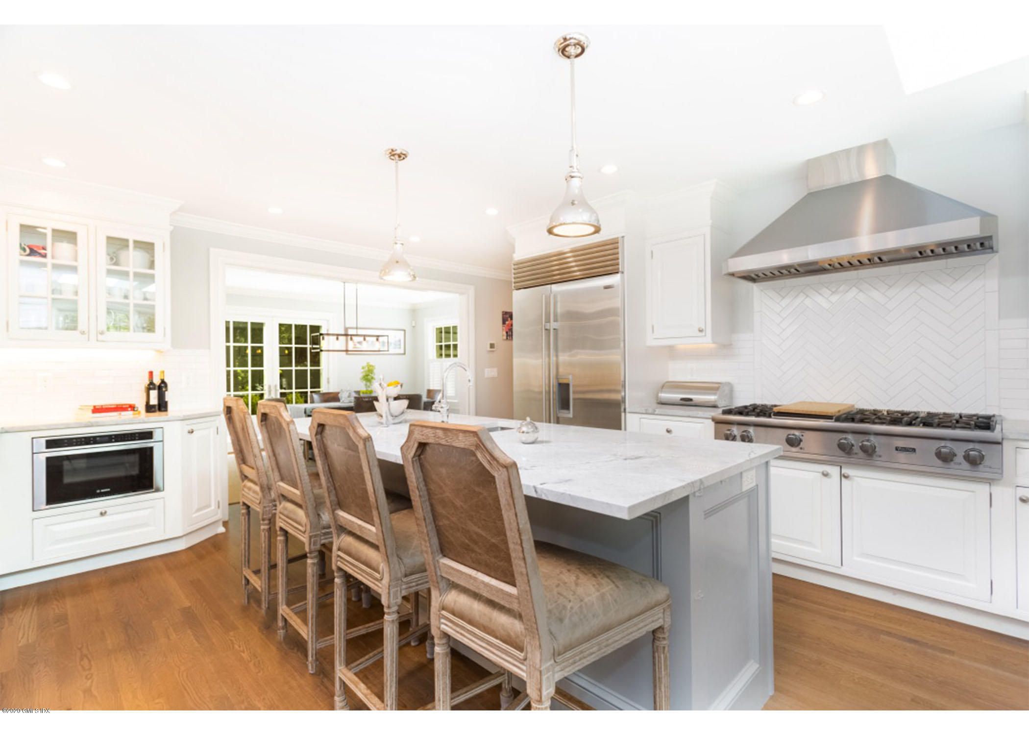 36 Evergreen Road Greenwich, CT 06830 - Photo 10 of 40 a kitchen with stainless steel appliances a stove a sink a counter top space and cabinets