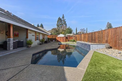 a view of a house with swimming pool