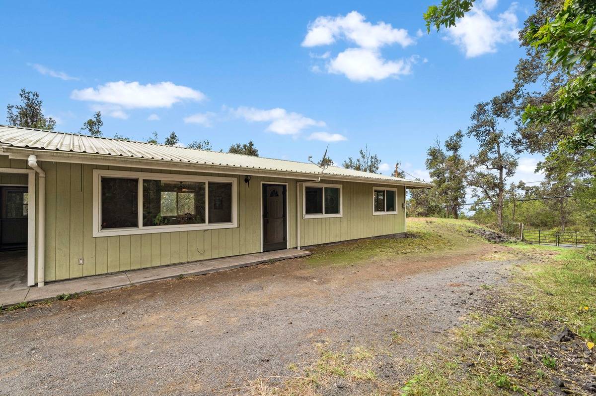 92-8786 Hawaii Boulevard Ocean View, HI 96704 - Photo 1 of 27 a view of a house with a yard