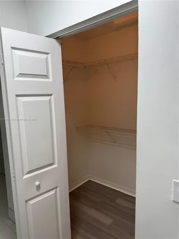 a view of a small space with wooden floor