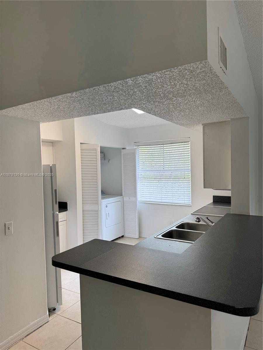 Pembroke Pines Pembroke Pines, FL 33024 - Photo 5 of 15 a kitchen with a sink cabinets and window