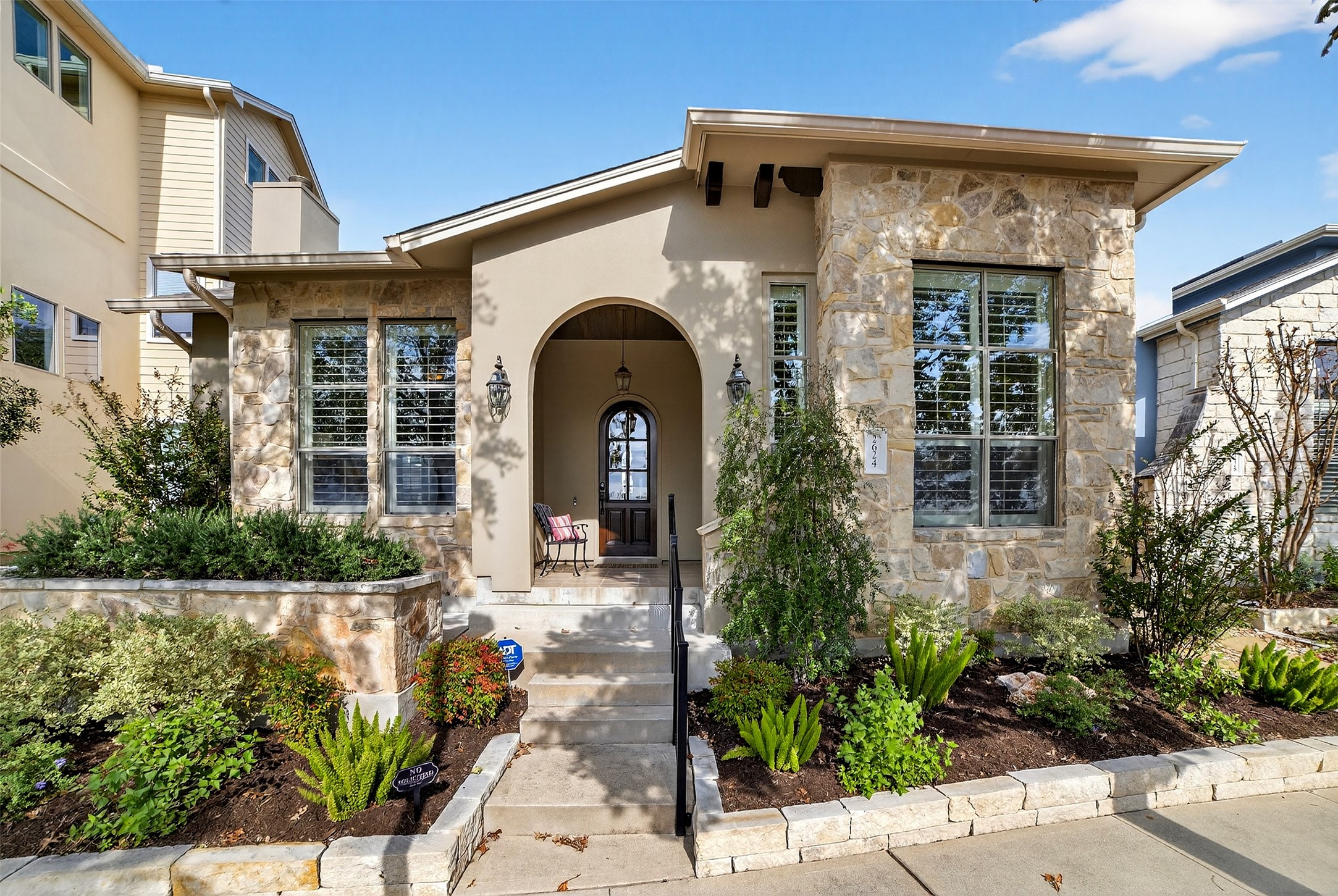 2624 Tom Miller Street Austin, TX 78723 - Photo 1 of 1 a front view of a house with garden