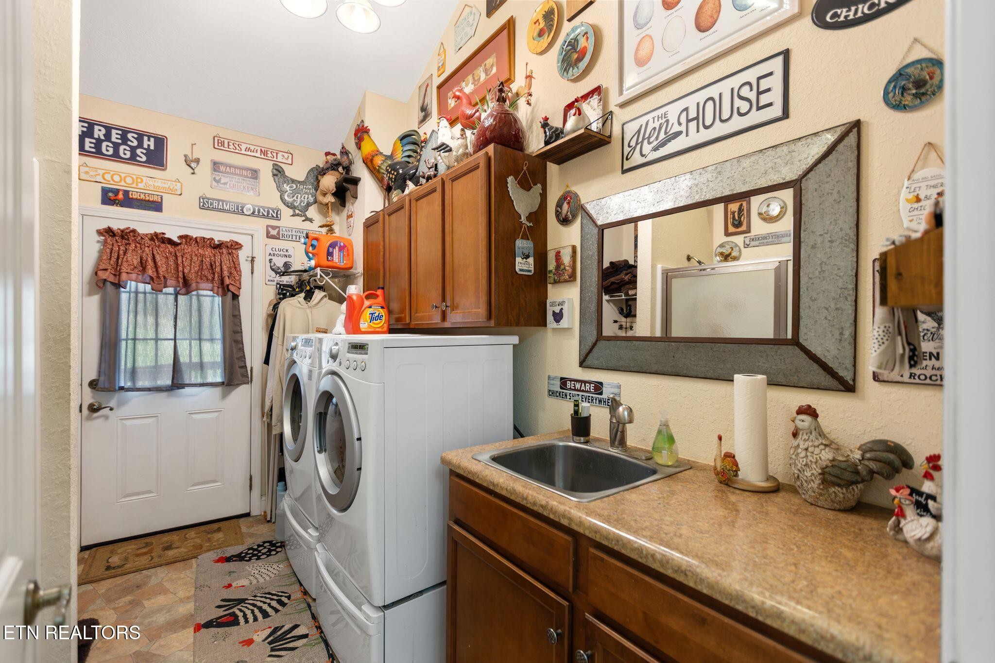 741 Clinch Valley Road Powder Springs, TN 37848 - Photo 18 of 50 a utility room with fridge and sink