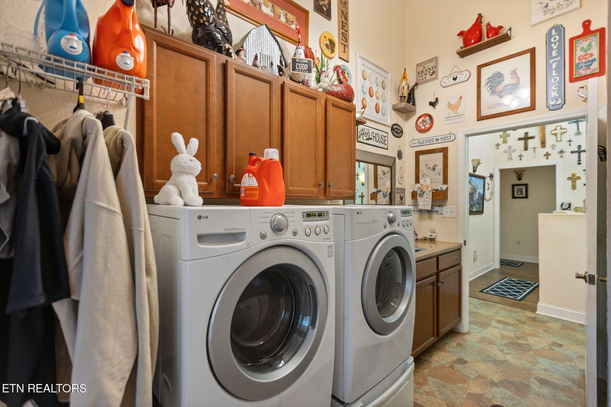 741 Clinch Valley Road Powder Springs, TN 37848 - Photo 19 of 50 a view of a storage & utility room with dryer and washer