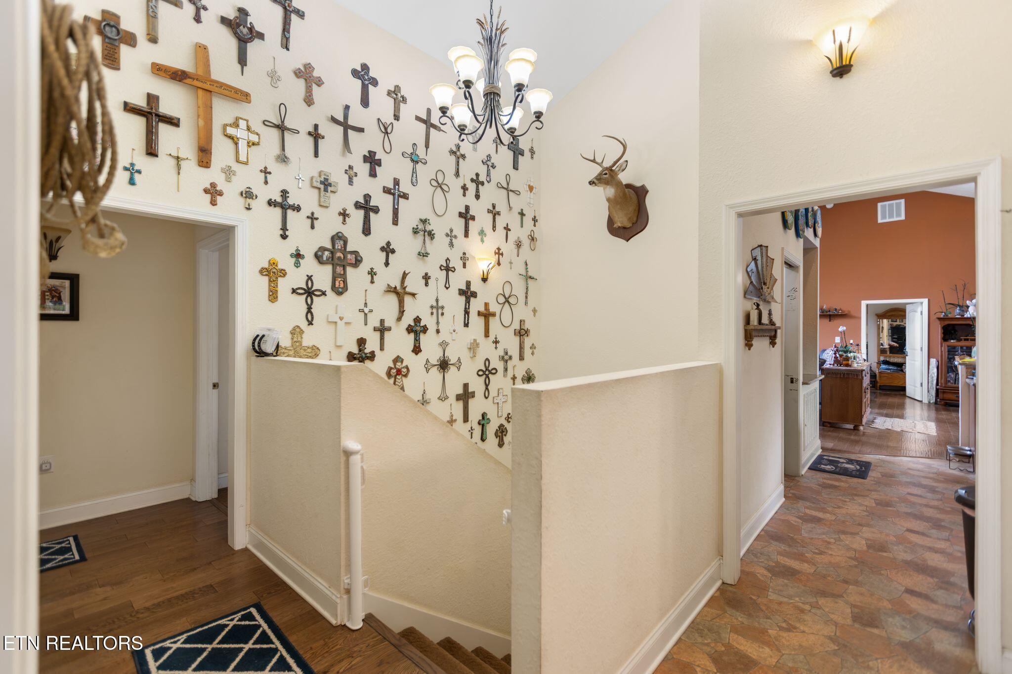 741 Clinch Valley Road Powder Springs, TN 37848 - Photo 21 of 50 a view of a hallway with a dining area with chandelier