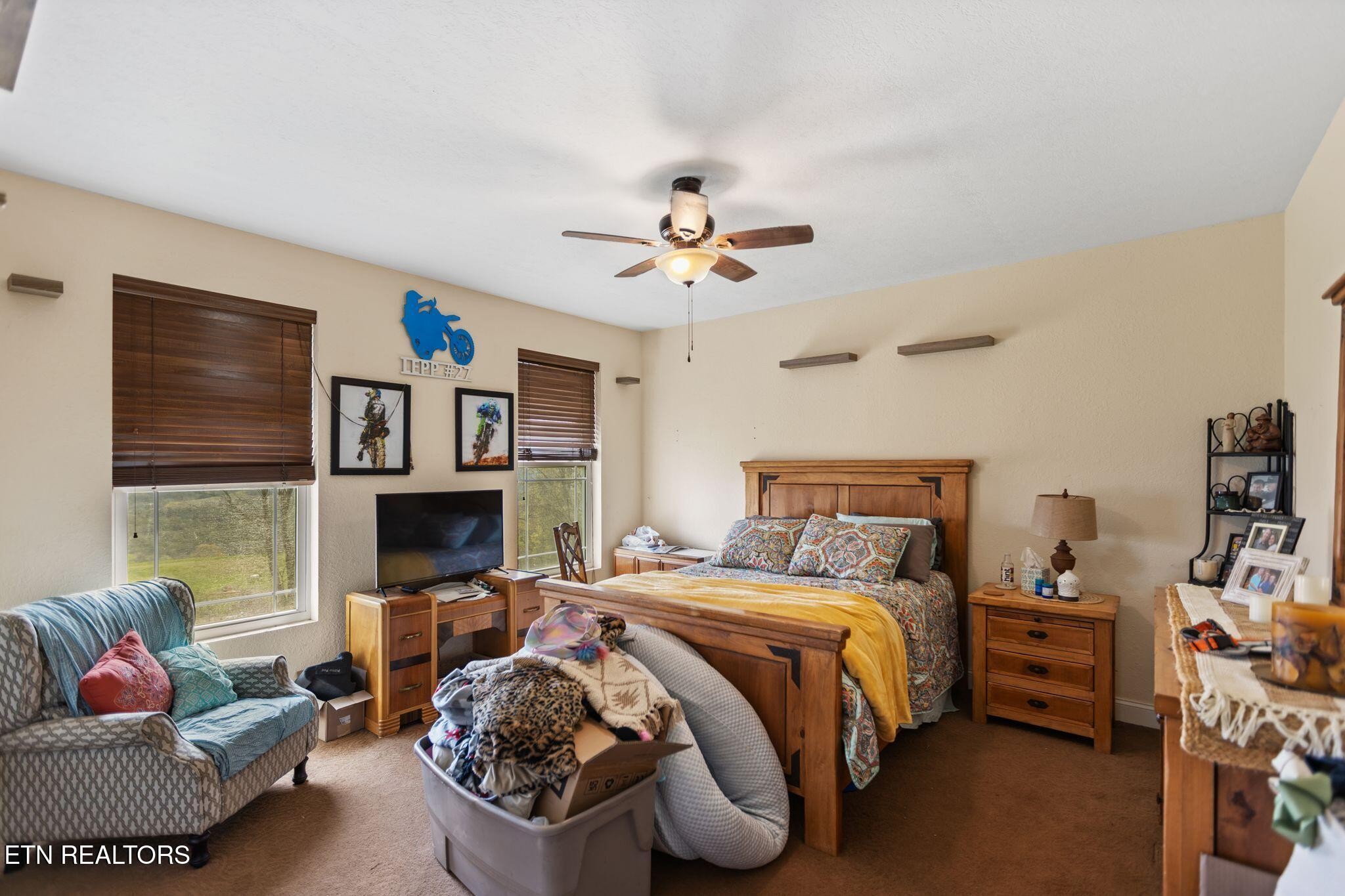 741 Clinch Valley Road Powder Springs, TN 37848 - Photo 24 of 50 a bedroom with furniture and a fireplace