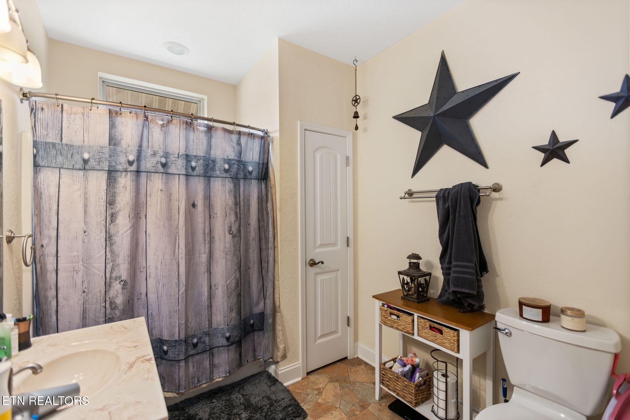 741 Clinch Valley Road Powder Springs, TN 37848 - Photo 26 of 50 a bathroom with a window and a shower