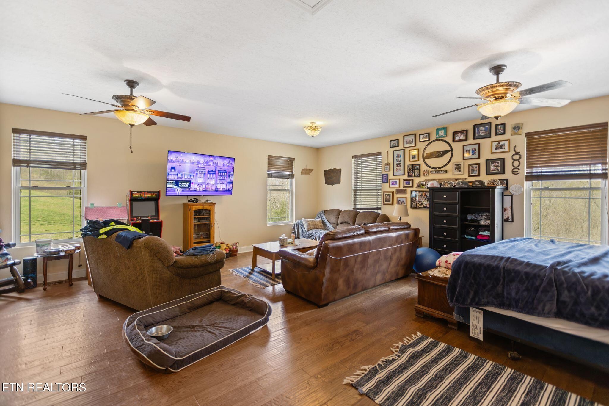 741 Clinch Valley Road Powder Springs, TN 37848 - Photo 28 of 50 a living room with furniture and a fireplace