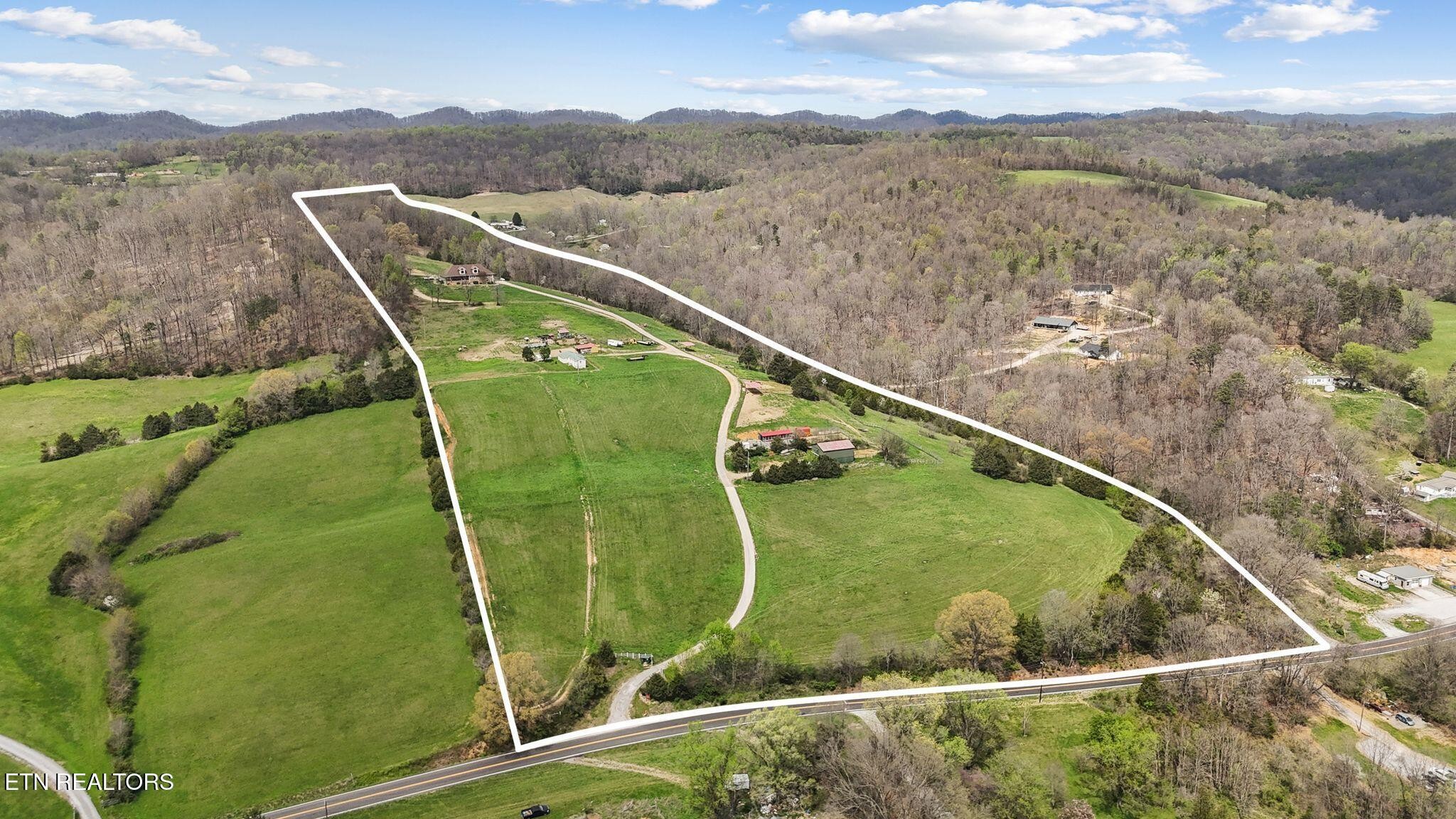 741 Clinch Valley Road Powder Springs, TN 37848 - Photo 3 of 50 a view of a swimming pool with a lake