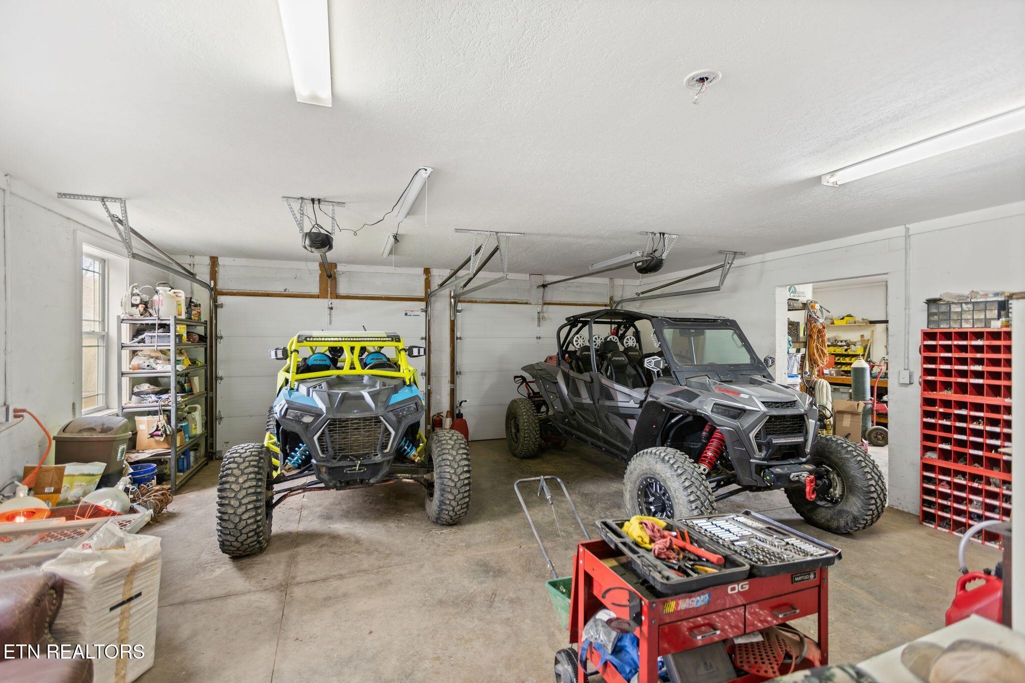 741 Clinch Valley Road Powder Springs, TN 37848 - Photo 34 of 50 a view of a garage with a bike and car